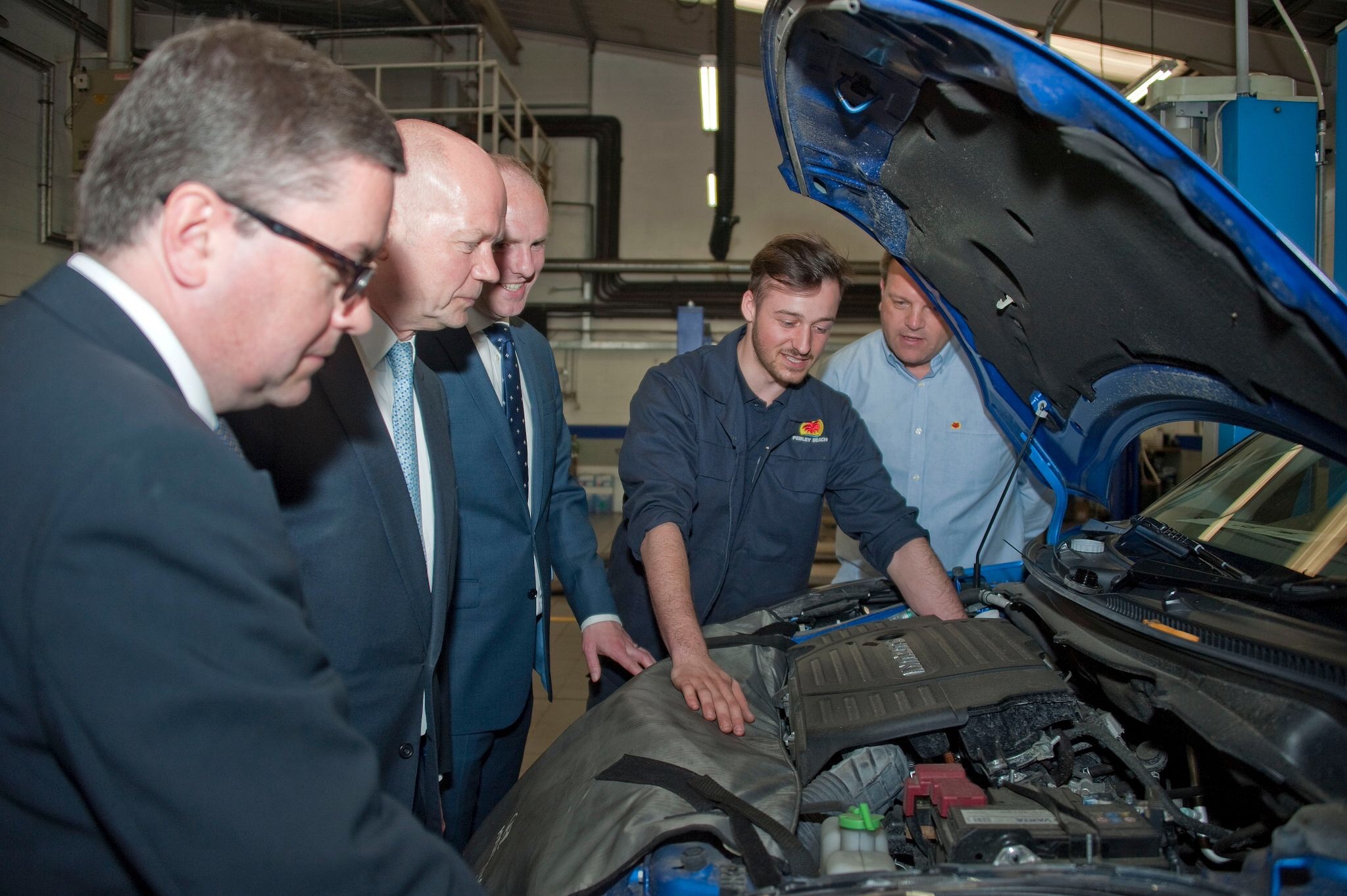 Top Tory promises apprenticeship drive during visit to car dealership